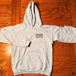 Lacrosse Unlimited Light Blue Hoodie with Mountain Design